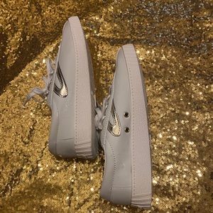 Gently worn ladies leather top Tretorn sneakers